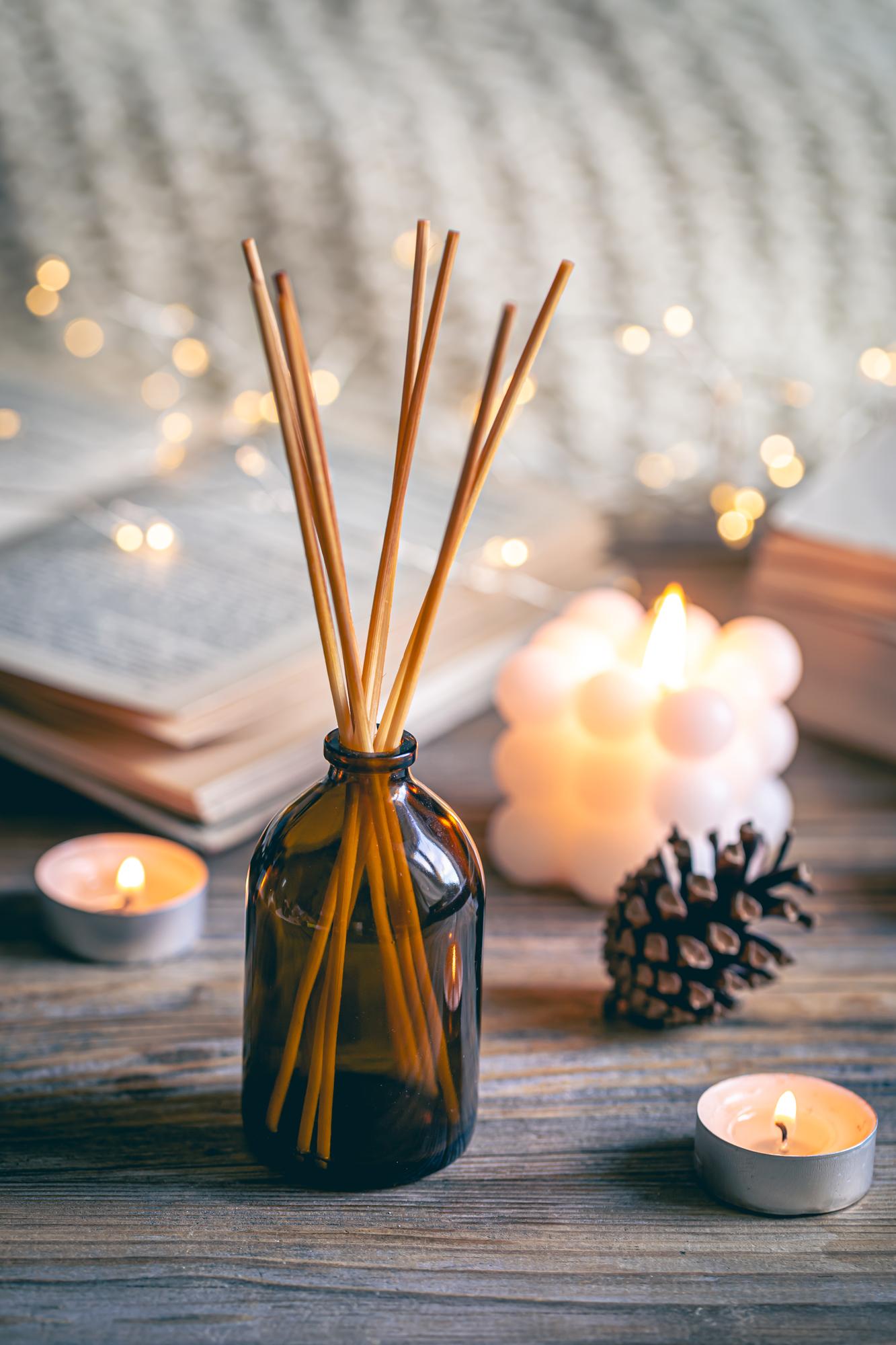 winter-spa-composition-with-incense-sticks-candles-bokeh-lights
